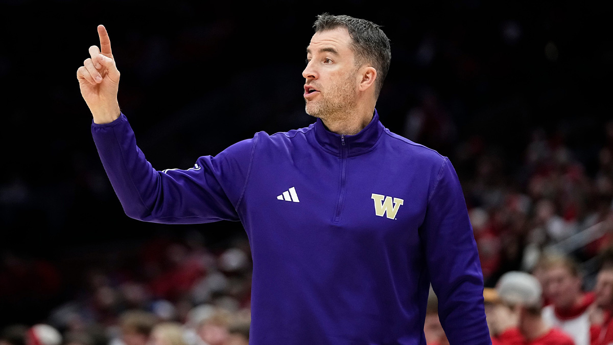 Washington Huskies head coach Danny Sprinkle motions to his team during the first half of the NCAA men's basketball game against the Ohio State Buckeyes at Value City Arena in Columbus on Feb. 12, 2025.